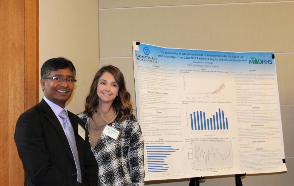 Image 1 of 15 Dr. Molla and a student standing together, smiling